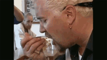 Guy Fieri Eating GIF - Guy Fieri Eating Reverse GIFs