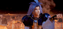 a video game character with a feather in his hair stands in front of a burning city