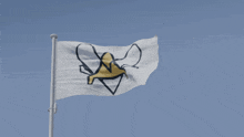 a white flag with a yellow and black logo on it