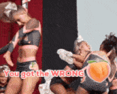 a group of cheerleaders are performing on a stage with the words " you got the wrong " on the bottom