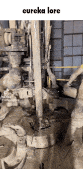 a man is working on a machine that says eureka lore on the top