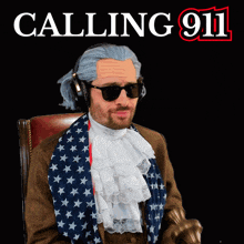 a man wearing a wig and sunglasses is sitting in front of a poster that says calling 911