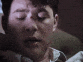 a man with a tear running down his face