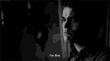 a black and white photo of a man saying `` i 'm fine . ''