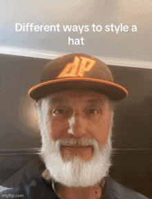 a man with a beard is wearing a hat that says dp on it