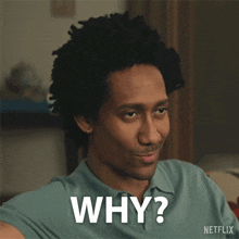a man in a blue shirt says why