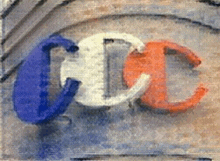 a blue white and orange sign with the letter c on it