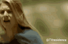 a close up of a woman 's face with the words @tvresidence on the bottom