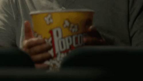 colbert eating popcorn gif