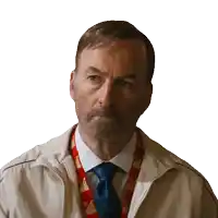 a man wearing a jacket and tie has a lanyard around his neck that says ' home depot ' on it