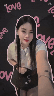 a woman is taking a selfie in front of a love background