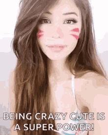 a woman is taking a selfie with a cat face paint on her face .