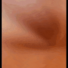 a close up of a person 's face with a blurred background .