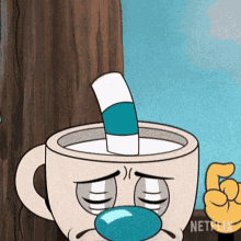 a cuphead cartoon character with a straw sticking out of his mouth