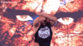 a man wearing a black tank top that says russel on it