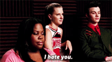 a cheerleader says i hate you while sitting next to two other people