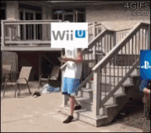a man walking down stairs with a wii u sign covering his face