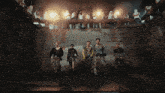 a group of people standing in a dark room