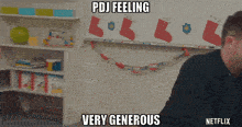 a man is sitting in front of a white board with stockings on it and the words pdj feeling very generous below him