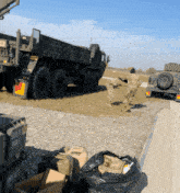 two soldiers are running towards a military truck that says insert not