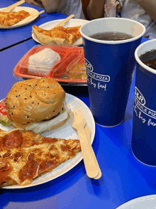 a blue cup that says ' s & r lifestyle pizza ' on it
