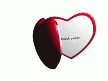 a heart shaped mirror with a picture of a man and the name akhileshwar yadav on it