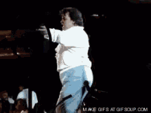 a gif of a person dancing with the words make gifs at gifsoup.com below it
