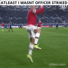 a soccer player is jumping in the air on a field with the words atleast i wasn