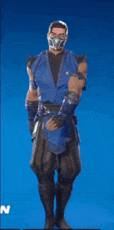 a man wearing a mask and gloves is standing in front of a blue background