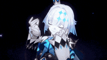 a girl with a crown on her head holds a blue object in her hand