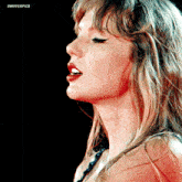 a close up of a woman 's face with the words swifterpics on the bottom right