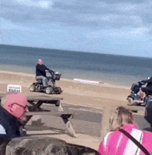 a man is riding a mobility scooter on a picnic table