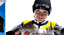 a person wearing a gorenje hat and a arienc shirt