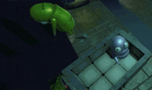 a green whale is swimming next to a purple object