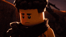 a close up of a lego character with an angry face
