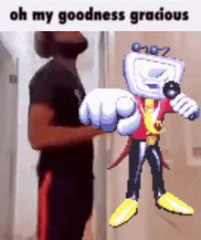 a man is standing next to a cartoon character that says oh my goodness gracious on it