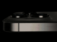 a close up of a pink object with two black circles on it