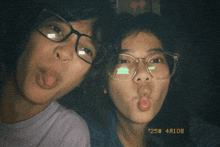 a man and a woman are making funny faces and the date of the photo is 25 4 10 8