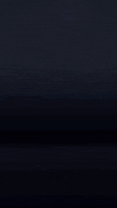 a purple fireworks display in the dark with a black background