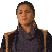 a woman wearing a purple sweater and gold earrings is making a face