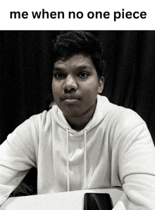 a black and white photo of a young man with the caption " me when no one piece " above him