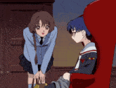 a girl standing next to a boy sitting in a red chair