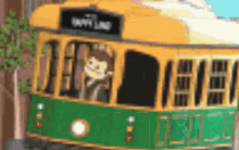 a cartoon drawing of a yellow and green trolley with a monkey driving it .