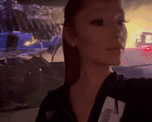 a woman with a name tag that says ' amanda ' on it takes a selfie