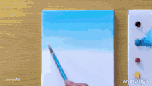 a person is painting a blue sky with a brush and the words made in animatica are visible