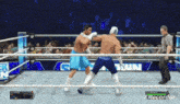 two men are fighting in a wrestling ring with the words xrecorder visible in the corner