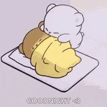 a cartoon of a teddy bear laying on a bed with a blanket .