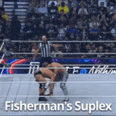 a fisherman 's suplex wrestling match with a referee