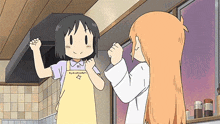 a girl wearing a yellow apron with a star on it is talking to another girl