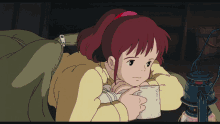 a girl with red hair is reading a book